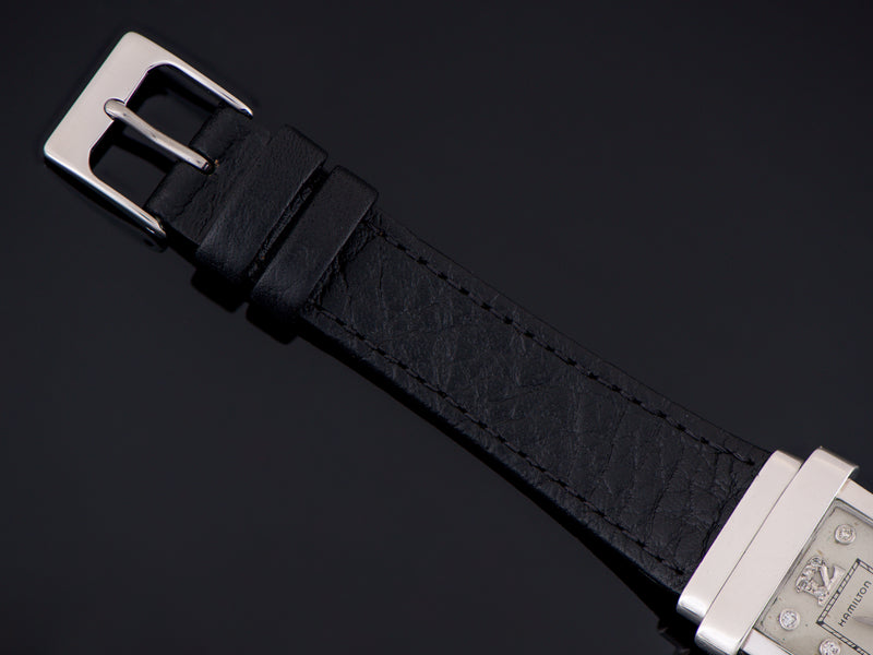 Brand new genuine leather black calf grain strap with matching silver tone buckle