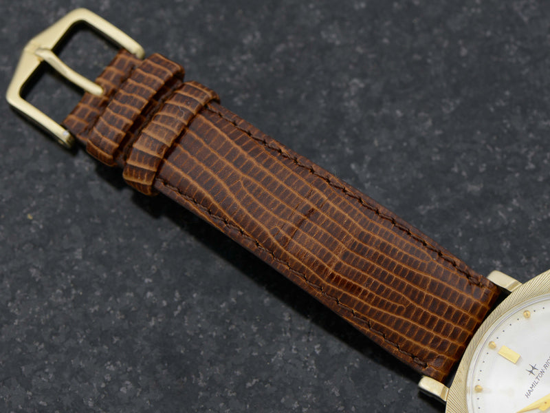 Brand new genuine leather Black Snake Grain Band with matching Gold Colored Buckle