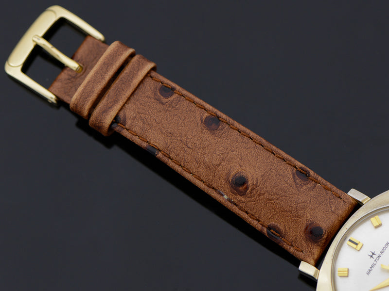 Brand new genuine leather Brown Ostrich Grain Band with matching Gold Colored Buckle