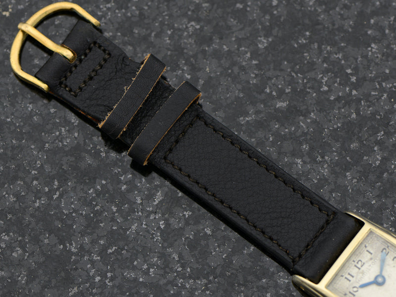 Brand New Old Stock Genuine Pigskin Black Watch Band with matching Gold Colored Buckle